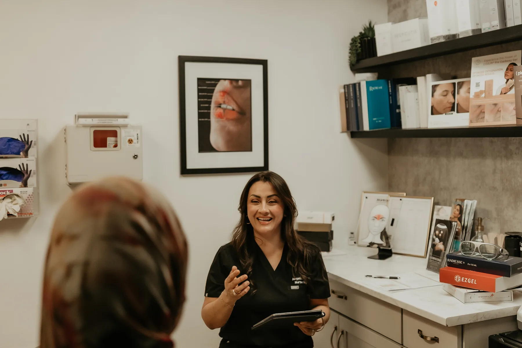 Angelica Alcaraz talking a client through a treatment plan at Revive Beauty Bar in Salinas