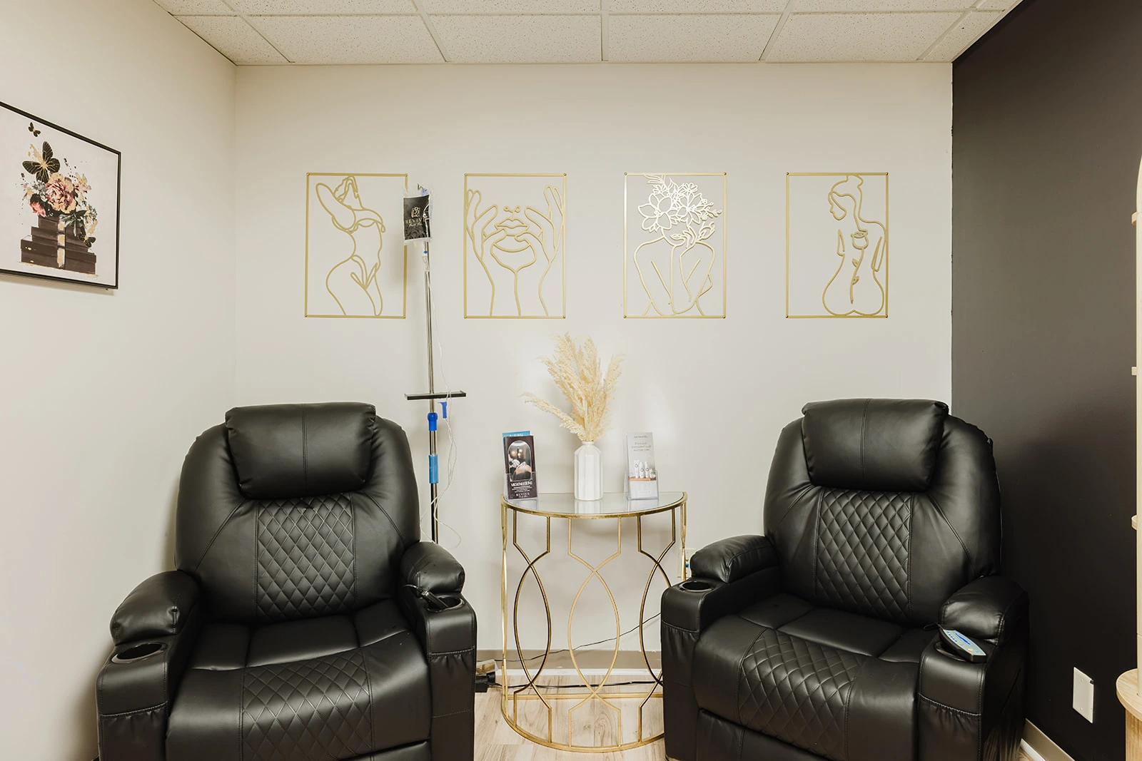 The IV therapy lounge at Revive Beauty Bar in Salinas, with recliners and a drip stand ready